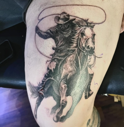 Realistic black and grey cowboy and horse tattoo created by Bullet’s Ink in Mt Airy, Maryland.