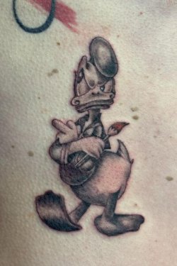 Donald Duck character tattoo by Robyn Hardman at Bullet’s Ink